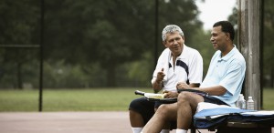 Two men playing tennis